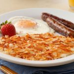 Hearty Cut Hash Browns Served with Eggs and Sausage